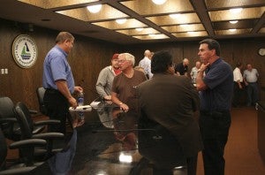 Sheriff candidates talk to area residents after the forum Wednesday evening. -- Kelli Lageson