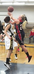 Taylor Steckelberg, a sophomore forward from United South Central, gets fouled in the paint against Granada-Huntley-East Chain. Steckelberg scored three points and grabbed three rebounds. -- Micah Bader/Albert Lea Triune