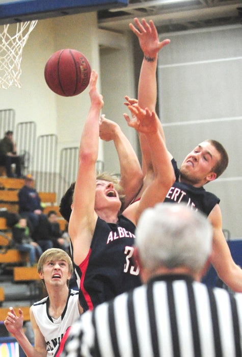 Cody Scherff (right) and Miles Erdman (left) attempt to grab an offensive rebound against Rochester Century on Tuesday. The Tigers trailed 10-2 after an alley-oop dunk by the Panthers on the game’s opening posession. However, Albert Lea went on a 22-4 run from there to take the lead for good en route to a 51-37 win. The Tigers are 12-10 overall. — Micah Bader/Albert Lea Tribune