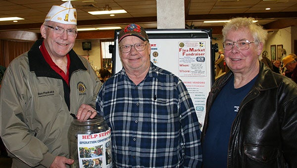 The state American Legion Commander Don Pankake, Albert Lea Beyond the Yellow Ribbon Chairman John Severtson and Albert Lea American Legion Commander Roger Bakken pose for a photo. The local Beyond the Yellow Ribbon group and Legion teamed up for a flea market fundraiser on Thursday and Friday that raised about $1,500, which will all go to Operation Comfort Warriors, a charity that provides non-medical comfort items to U.S. soldiers recovering at medical facilities around the world. -- Submitted