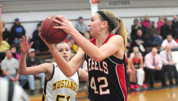 Amanda Allis of United South Central takes the ball to the rim against Granada-Huntley-East Chain. Allis earned five points, six rebounds, four assists, three steals, four blocks in the Rebels' win. -- Micah Bader/Albert Lea Tribune.