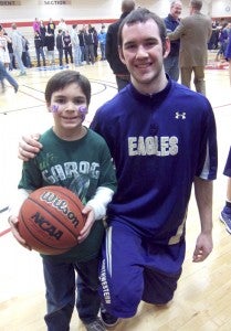 Kyle Ooms, formerly of Albert Lea High School and  currently of Northwestern College, met with one of his biggest fans, seven-year-old Spencer Jones of Albert Lea. -- Submitted