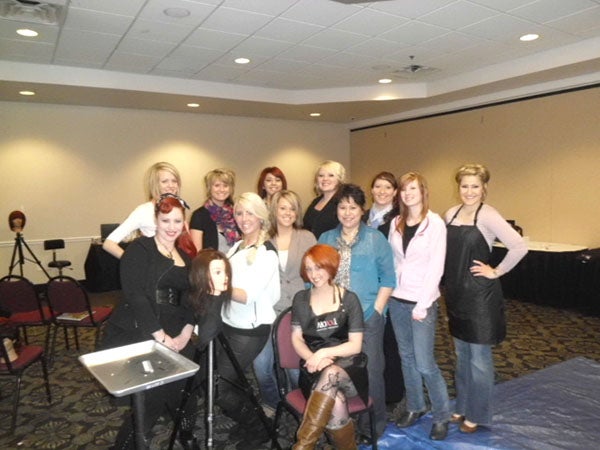 Expressions Salon staff pose for a photo at a recent workshop in Rochester. — Submitted