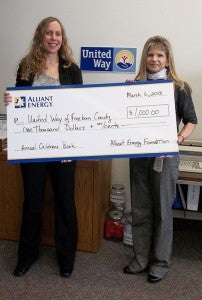Rebecca Gisel, right, from Alliant Energy presents the annual children’s book donation from Alliant Energy of $1,000 to Ann Austin, executive director of the United Way of Freeborn County. --Submitted 
