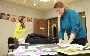 Albert Lea High School teachers Robin Brown, right, and Raissa Byer work to hang up student art in the Albert Lea Art Center earlier this week. The annual Elementary/Secondary Student Art Show starts with an open house from 1 to 3 p.m. Sunday. 