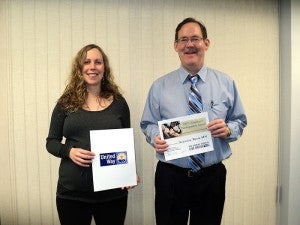 Security Bank Minnesota was given the United Way 100 Percent Employee Participation Award. Pictured from left are Ann Austin from the United Way and Tim Lenhart the president of Security Bank Minnesota. --Submitted