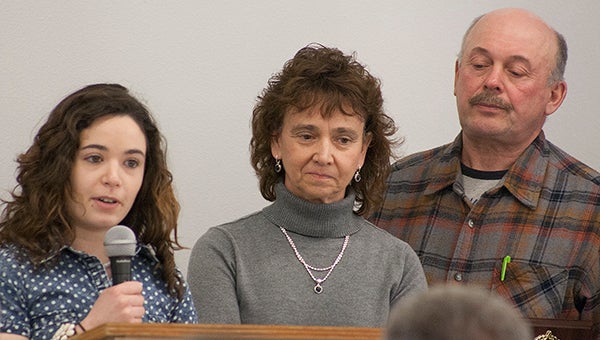 Lindsey Miller, left, speaks on behalf of her family to accept the award as Freeborn County Farm Family of the Year Tuesday at the Albert Lea-Freeborn County Chamber of Commerce Agricultural Luncheon. Standing next to her are her parents, Alana and John Miller. Not pictured is Dick Miller. -- Sarah Stultz/Albert Lea Tribune