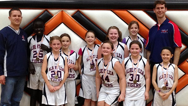 SubmittedThe 2012-13 fourth-grade Albert Lea girls’ traveling basketball team finished its season as consolation champs at a tournament in Sleepy Eye. From the left are coach Chad Adams, Leah Dup, Mallory Luhring, Zoe Sadauskis, Erin Utz, Madi Fleek, Cassidy Stromley, Laney Collier, Julia Morrow, Alivia Adams and coach Chris Utz. Not pictured are Grace Heinz and Dyna Bolinger.