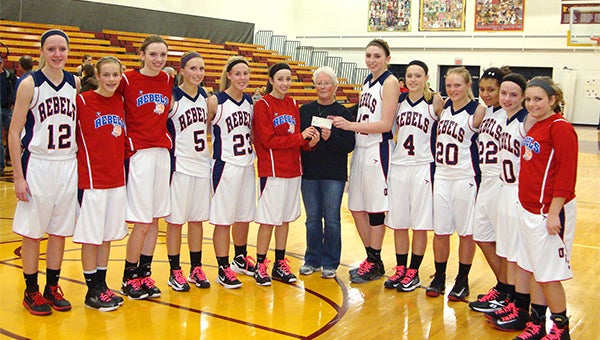 Members of the United South Central girls’ basketball team, including team captain Amanda Allis and Caitlyn Klocek, presented a check to Pam Klocek with funds raised from the Rebels’ Pink Out game.  The game was played in support of breast cancer awareness. Pam — Caitlyn’s grandmother —  is a breast cancer survivor. — Submitted