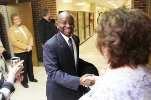 Riverland President-to-be Adenuga Atewologun shakes hands with Vicki Lunning, a Riverland business consultant for training and development, and other Riverland workers at the Albert Lea campus Thursday morning.