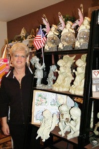Linda Schultz-Nelson stands next to some figurines for sale in her store in Freeborn, which opens today. It is open from 10 a.m. to 6 p.m. today, with normal hours of 10 to 4 p.m. Tuesdays and Thursdays. --Shelly Zeller/Alden Advance