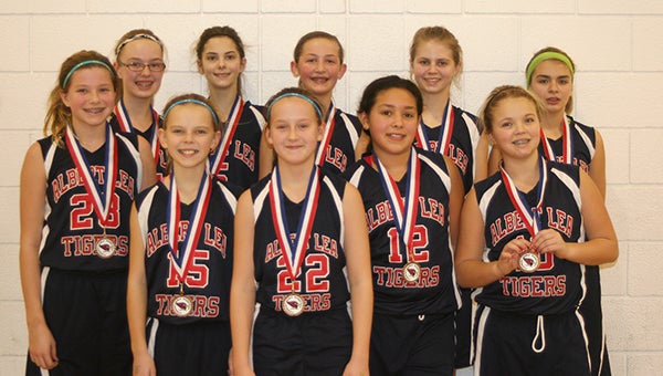 The Albert Lea sixth grade girls’ traveling basketball team earned third place in a tournament in Fairmont on Feb. 17. Front row from the left are Rylie Tollefson, Emma Loch, Taysha Sternhagen, Cassidy Daniel and Lexus Saltou. Back row from the left are Grace Chalmers, Anna Grossman, Courtney Claassen, Julissa Gilbertson and Megan Johnson. Mikaela Pannkuk was not pictured.  The team was coached by Neil Chalmers and Sue Miller. — Submitted
