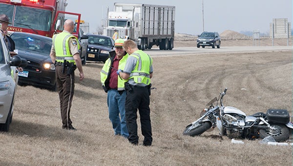 Freeborn County Sheriff's Office deputies and other authorities respond to a motorcycle crash on Interstate 35 Monday afternoon about four miles north of the Iowa border. -- Sarah Stultz/Albert Lea Tribune