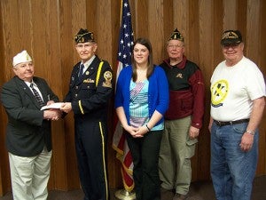 A flea market fundraiser, held by the Albert Lea American Legion Post 56 and the Albert Lea Beyond the Yellow Ribbon group raised a total of $1,860 for Operation Comfort Warriors, a nonprofit program that provides comfort items to American soldiers recovering at medical facilities around the world. From left are Arnold Troe, vice commander for district one and three of the Department of Minnesota American Legion and Emmons Post No. 317 member, David R. Olson, chaplain at the Albert Lea Legion, Kelli Lageson, member of Albert Lea Beyond the Yellow Ribbon, Roger Bakken, commander of Albert Lea’s Legion, and John Severtson, chairman of the Albert Lea Beyond the Yellow Ribbon group and Legion member. --Submitted
