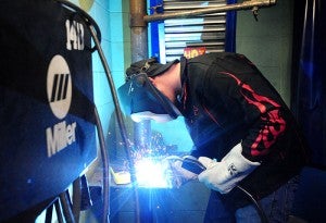 A high school student completes the wire welding section of Riverland Community College's seventh annual welding competition Friday in Albert Lea.