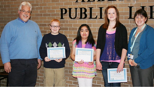 The Albert Lea Human Rights Commission selected the winners of its Human Rights Commission Essay Contest. They are Gisell Palomares-Amaya, first place, $100; Sawyer Nelson, second place, $75; and Hannah Ruble, third place, $50. Gisell’s essay will also be entered into the state contest. The winners were honored during the Albert Lea City Council meeting on April 8 by Mayor Vern Rasmussen and Human Rights Commission liaison Mike Zelenak. The children read their essays at the Taste of Heritage Festival at the Northbridge Mall on April 6. All the winners were from Erin Gustafson’s class at Southwest Middle School. In the photo left to right are Zelenak, Sawyer, Gisell, Hannah and Gustafson. --Submitted