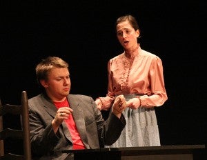Matt Bera, seated, plays Dr. Gibbs and Isabel Ehrhardt plays Mrs. Gibbs in the Albert Lea High School production of “Our Town.”