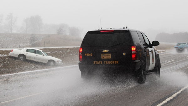 A state trooper slows to assist a motorist Monday on Interstate 90 between Albert Lea and Alden. -- Tim Engstrom/Albert Lea Tribune