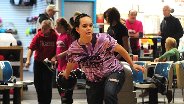 Brianna Oftedahl prepares to throw a bowling ball down a lane Monday at Holiday Lanes in Albert Lea. The Albert Lea girls’ bowling team celebrated a fourth-place finish at the state tournament last weekend. Oftedahl was a third-team All-State selection. — Micah Bader/Albert Lea Tribune