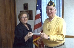 Albert Lea DOES Drove No. 70 President Jeanette Ladlie presents a $100 check to Cmdr. Roger Bakken of the American Legion Post No. 56 in appreciation for the use of their facility. --Submitted