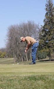 Derby Olson, a resident of Albert Lea and a member of the Green Lea Golf Club for the last 20 years takes a put Friday. — Micah Bader/Albert Lea Tribune