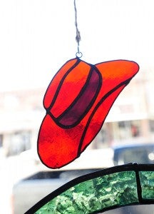 A red hat ornament hangs in the window of Trish's Gift Gallery on Broadway Avenue in New Richland.