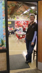 Hollandale Christian School Principal Lisa Vos poses for a photo in the kindergarten room, one of the classrooms that still needs its floor redone.