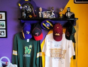 Sports memorabilia hangs on a wall near Brad Goette’s bed. Even though the North Stars are no longer a Minnesota team, a jersey still hangs in Goette’s room because he was a fan of the team when it did play in Minnesota.