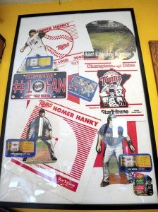 A picture frame displays Homer Hankies and other baseball memorabilia that Brad Goette has collected while being a Minnesota Twins fan. 