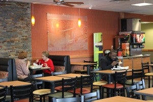 Customers eat their submarine sandwiches at the new Subway in Wells. The dining area can seat up to 81 people.
