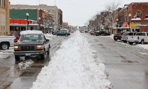 Albert Lea is known for piling snow in the middle of the downtown streets. It is not known for having to do it in May. -- Tim Engstrom/Albert Lea Tribune