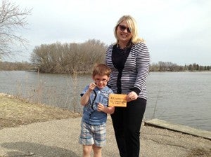 The annual lake cleanup was April 27 near Albert Lea Lake. Walmart in Albert Lea donated a $25 gift card for the most notable item collected that day. The recipient of the prize collected a live snake, which was later released. Pictured from left are Cohen Drescher of Albert Lea and Laura Lunde, the Lakes Foundation organizer. --Submitted