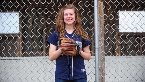 Meagan Nelson stands in front of Glenville-Emmons’ dugout. Nelson earned the Golden Glove Award last season. — Micah Bader/Albert Lea Tribune