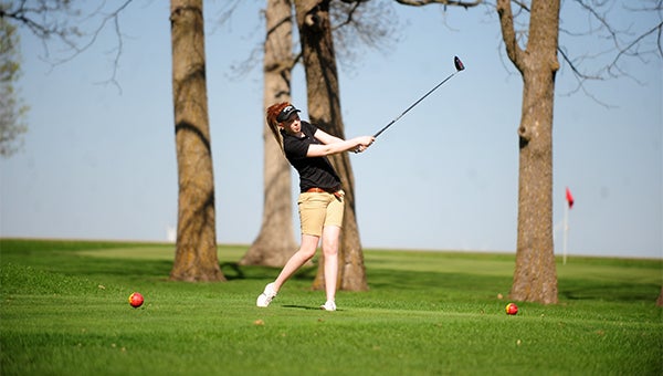Lily Gjersvik of Albert Lea tees off against golfers from Alden-Conger and United South Central Friday in a Triangular at Oak View Golf Course. — Micah Bader/Albert Lea Tribune