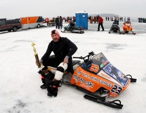 John Enger sits on his snowmobile with his first-place trophy after a win in Waconia. — Brandi Hagen/Albert Lea Tribune