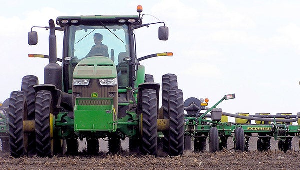 Alan Roelofs drives a corn planter in a field near his southwest Minnesota farm two miles southwest of Tyler. --Mark Steil/MPR News