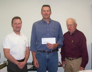 The Freeborn County Fair received a grant of $2,500 from Alliant Energy to sponsor the Elephant Encounter show. Pictured are Troy Thompson, left, and Norm Fredin, right, of the Freeborn County Fair, with Al Stadheim, center, with Alliant Energy. --Submitted