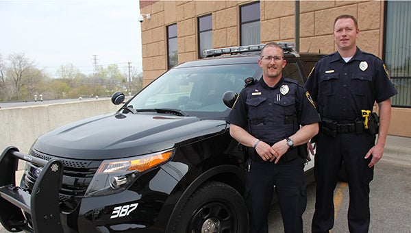 New Albert Lea Police Department officers Erik Melia, left, and Todd Deming pose in front of one of the department’s new squad cars Monday in front of the Law Enforcement Center. -- Sarah Stultz/Albert Lea Tribune