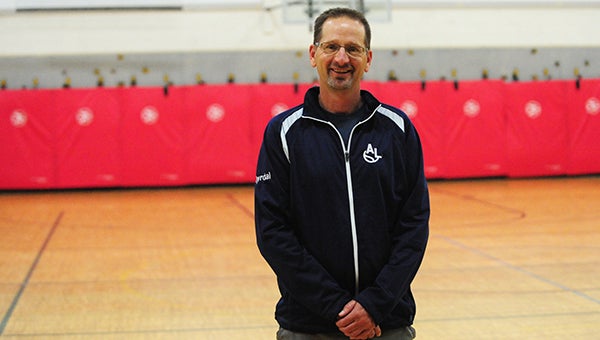 Tom Dyrdal stands in the gym at Hawthorne Elementary, the practice site of the Albert Lea boys’ tennis team when snow covered the tennis courts early this season. Dyrdal teaches physical education to kindergarten through fifth-grade kids at Hawthorne. Dyrdal was named the Big Nine Conference boys’ tennis Coach of the Year in 2013. — Micah Bader/Albert Lea Tribune