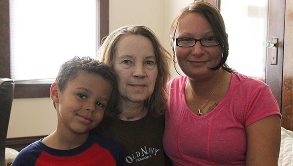 Jayden, left, sits with his grandma Sandy, middle, and mom Michelle, right. Jayden called 911 two months ago when Sandy suffered a heart attack. --Kelli Lageson/Albert Lea Tribune