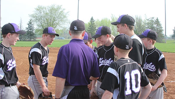 Albert Lea 13AAA head coach Kelly Bordewick instructs his players after time is called on the field. The 13AAA Knights earned third place in the Baseball Slugfest, which took place Friday through Sunday. — Kelly Bordewick/ For the Albert Lea Tribune