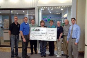 Deb Steinfeldt and Andy Linder of AgStar Financial Services present a $1,500 grant from AgStar’s Fund for Rural America to the Chamber of Commerce Ag Committee. The grant will be used for the annual third-grade farm tours. The 2013 tours will be the 22nd year that the Chamber’s Ag Committee has hosted the event for all third-graders in Freeborn County. --Submitted