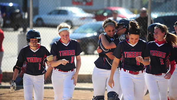 Caycee Gilbertson, a junior from Albert Lea, is congratulated by her teammates for hitting her first home run over the season Thursday in an 8-0 win over Austin during the first round of the Section 1AAA softball tournament. —Micah Bader/Albert Lea Tribune