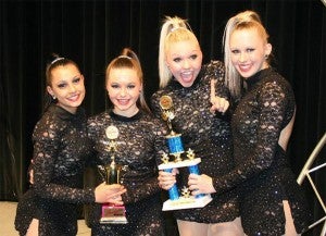 Teams from the United Possibilities Dance Studio competed in a Showstoppers competition in Bloomington. From the left are Alyssa Larsen, Aubrey Olson, Mina Jasarovska, Chloe Bushlack. They received first place in their division. — Submitted