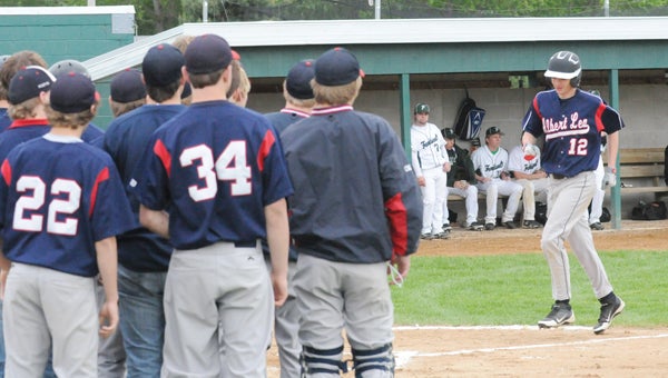 Albert Lea’s Wyatt Paulsen is greeted by teammates at home plate after hitting a solo home run in the second inning. —  Josh Berhow/Faribault Daily News