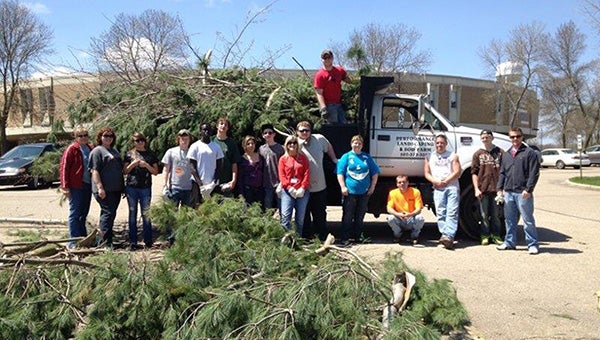 Students at Albert Lea's Area Learning Center volunteered to help clean up after the May 2 snow storm. Performance Landscaping and Sod Farm volunteered their truck, time and service to help students with their cleanup effort. Pictured from left are Mary Beese, Nyla Anderson, Samantha Weldon, Jarrod Inderlie, Nhiam Ngut, Andrew Steele, Jazmin Bueno, Russell Lien, Nicky Severtson, Delane Calhoun, Caleb Sorenson, Breanna Marquardt, two Performance Landscaping staff, Travis Anderson and David Enser. -- Submitted 