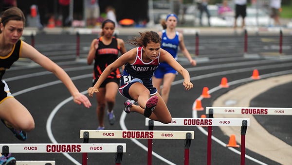Larissa Hacker, a junior hurdler from Albert Lea, runs in the 300-meter low hurdles Thursday at the Section 1AA track and field meet at Lakeville South High School. — Micah Bader/Albert Lea Tribune