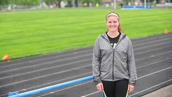 Hanna DeVries, a junior from Albert Lea, stands near Jim Gustafson Field Tuesday before practice. DeVries has competed in the discus and the shot put this season. At the Big Nine Conference Meet, DeVries earned 17th place in the shot put and 20th place in the discus. — Micah Bader/Albert Lea Tribune