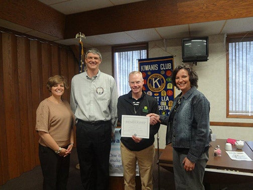 Scott Erlandson, store manager for Erlandson Implement Co. was recently inducted as a member of the Albert Lea Noon Kiwanis Club. Pictured from left are Rhonda Allison, president, Mark Smed, sponsor, Erlandson and Angie Eggum, immediate past president. --Submitted