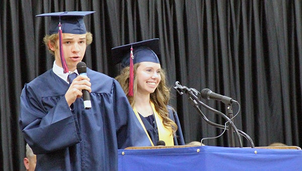 Seniors Andy Ehrhardt and Kelli Sanderson address their classmates and a gym full of parents, family and friends during commencement Friday night at Albert Lea High School. -- Kelli Lageson/Albert Lea Tribune